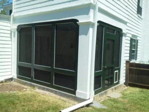 Framed addition with snow-ready roof structure in New Hampshire